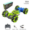 A blue and lime green 55A Stunt Vehicle remote control with a battery and USB charging cable.