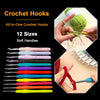 A collection of 12 crochet hooks in various sizes and colors displayed next to a ball of green yarn.