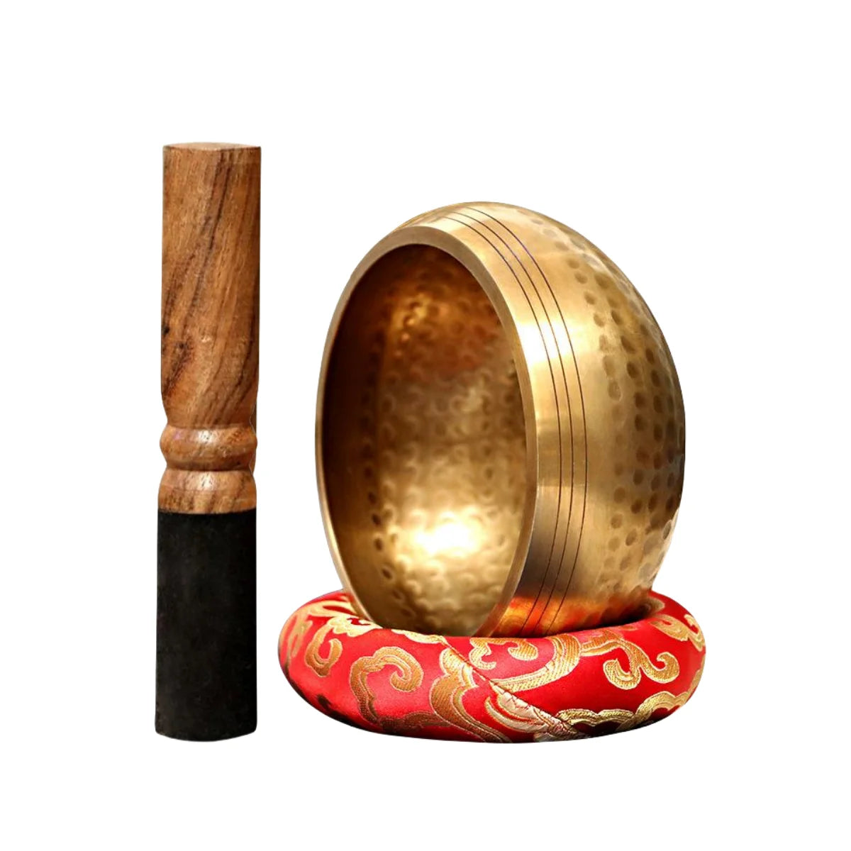 A handcrafted Tibetan singing bowl with a brass bowl, wooden mallet, and a red silk cushion.
