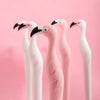 A set of pink and white bird-themed diamond painting accessories with black beaks