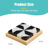 A white and black 3D block puzzle cube is shown on a wooden base.