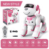 Un robot animal de compagnie interactif blanc et rose pour enfants avec accessoires de contrôle et emballage.