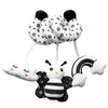 A set of spiral sensory rattles featuring black and white polka dots and a bee design.
