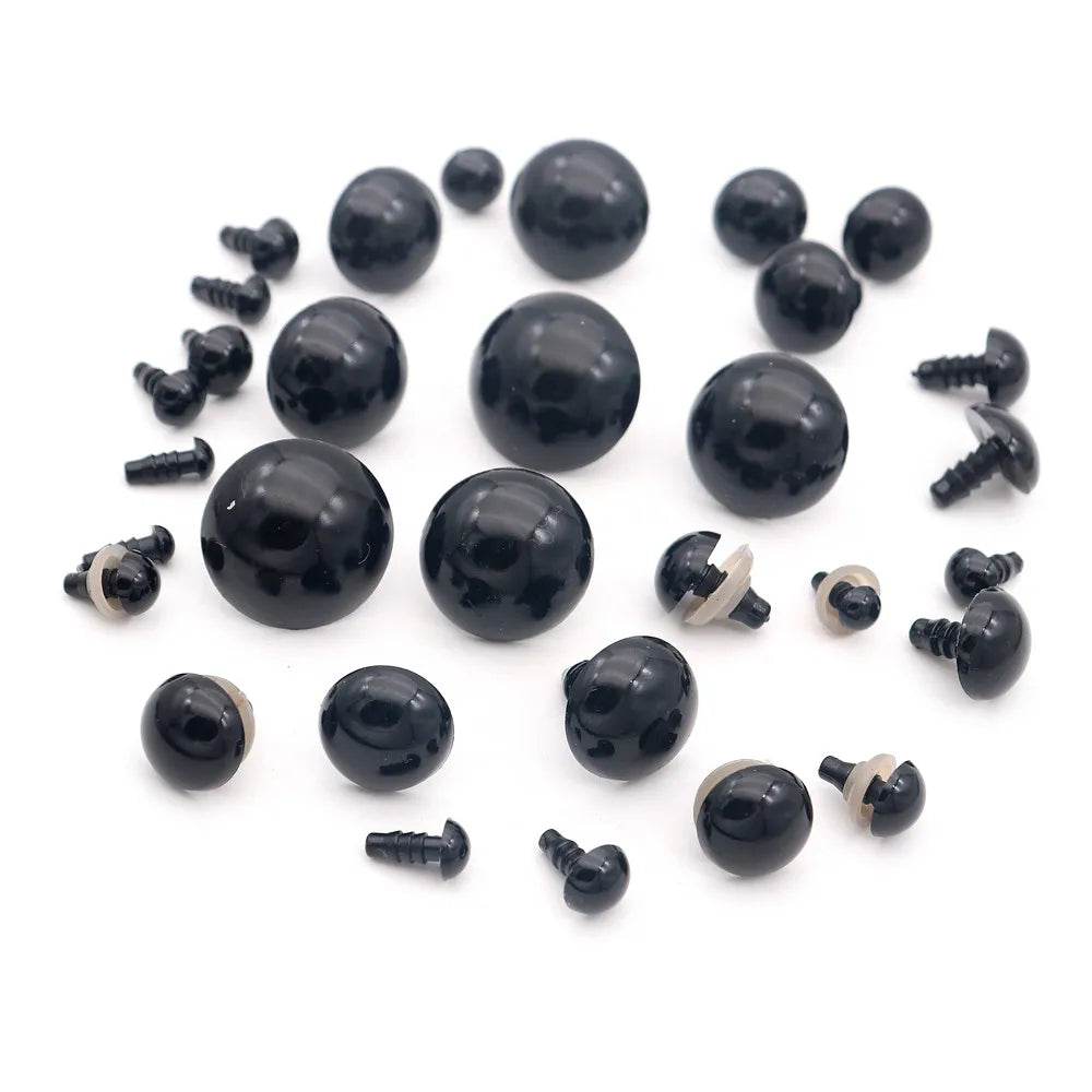 A collection of black plastic safety eyes with washers for crafting and stuffed animals