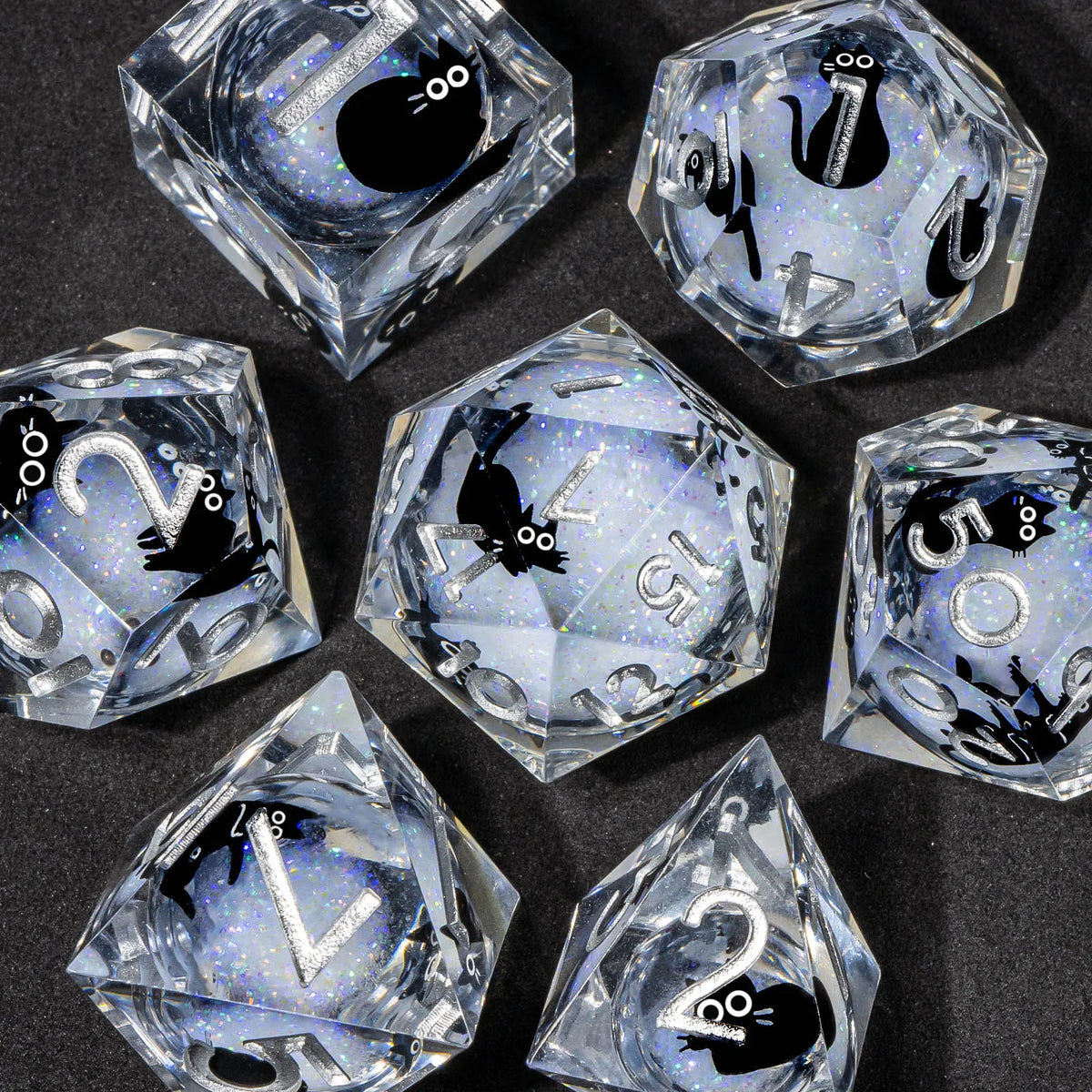 A collection of clear liquid core resin dice set with sharp edges, featuring various numbers and symbols.