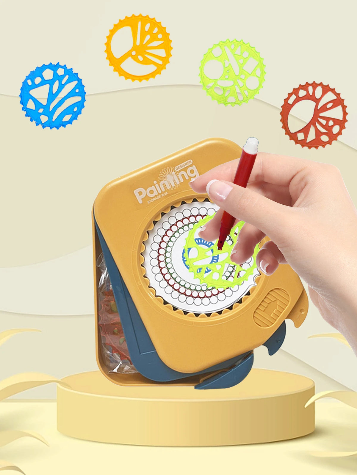 A hand is using a yellow Spirograph drawing set to create colorful geometric patterns on a page.