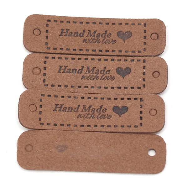 A set of four brown leather-style handmade with love tags for crafts and sewing.