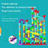 A colorful set of plastic marble run building blocks with various colored tubes and structures.