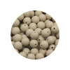 A circular arrangement of small, light-colored silicone beads in various sizes.
