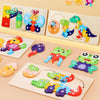 A set of wooden dinosaur puzzles featuring various cartoon dinosaurs in different colors and sizes.