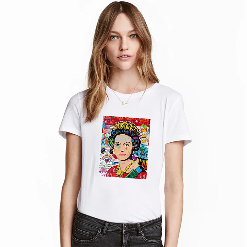 A woman models a white t-shirt featuring a colorful, vintage-style graphic print on the front.