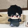 A chibi plush keychain of a black-haired character with large red eyes and a dark outfit.