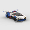 A detailed model of a classic supercar built from blue, white, and red building blocks.