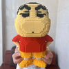 A detailed mini building blocks model kit of a character, featuring yellow skin and an orange shirt.
