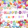A colorful assortment of mixed acrylic letter beads in various colors and shapes for DIY crafts