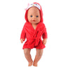 A baby doll wearing a red cartoon animal bathrobe and nightgown set.