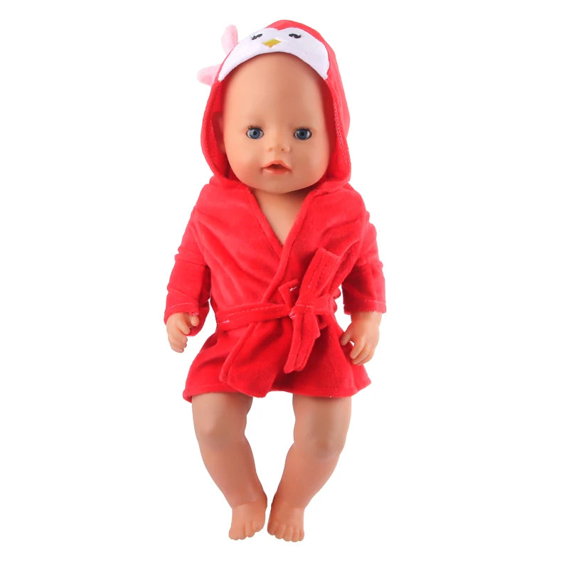 A baby doll wearing a red cartoon animal bathrobe and nightgown set.