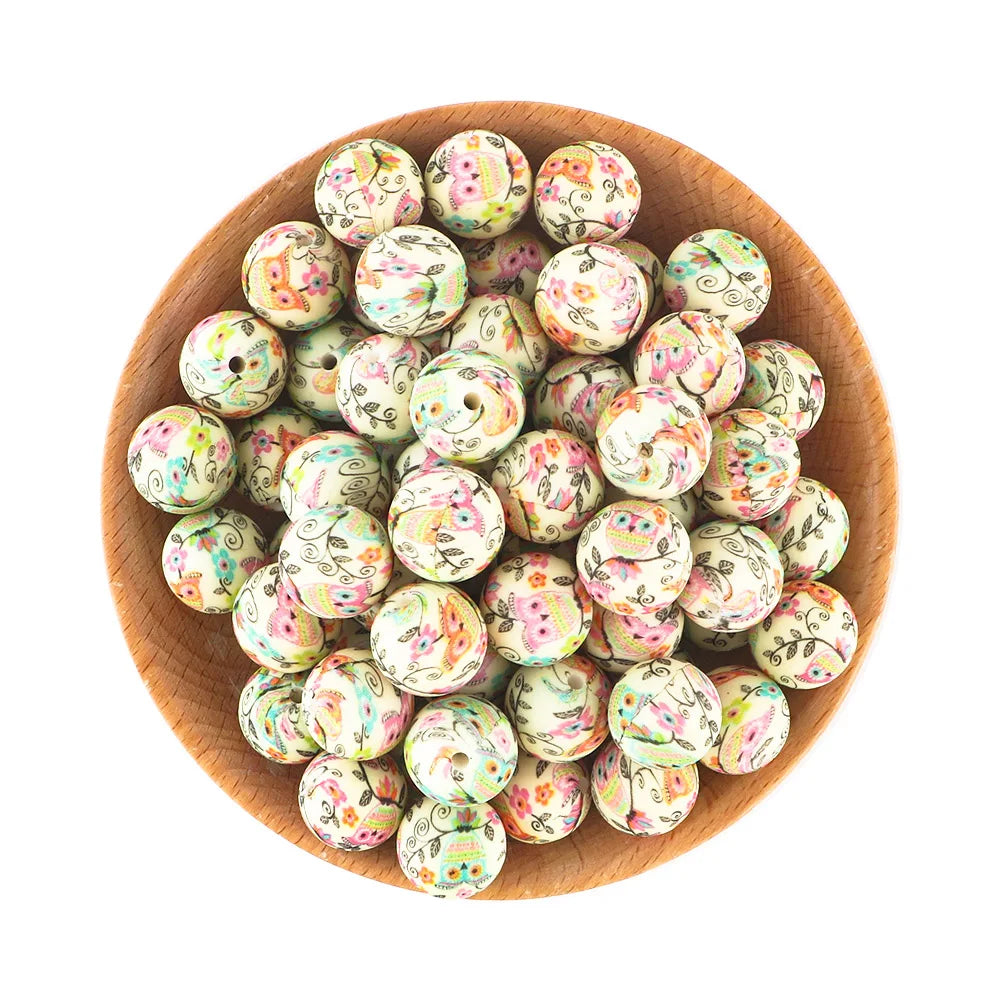 A bowl filled with colorful, round silicone beads for jewelry making.