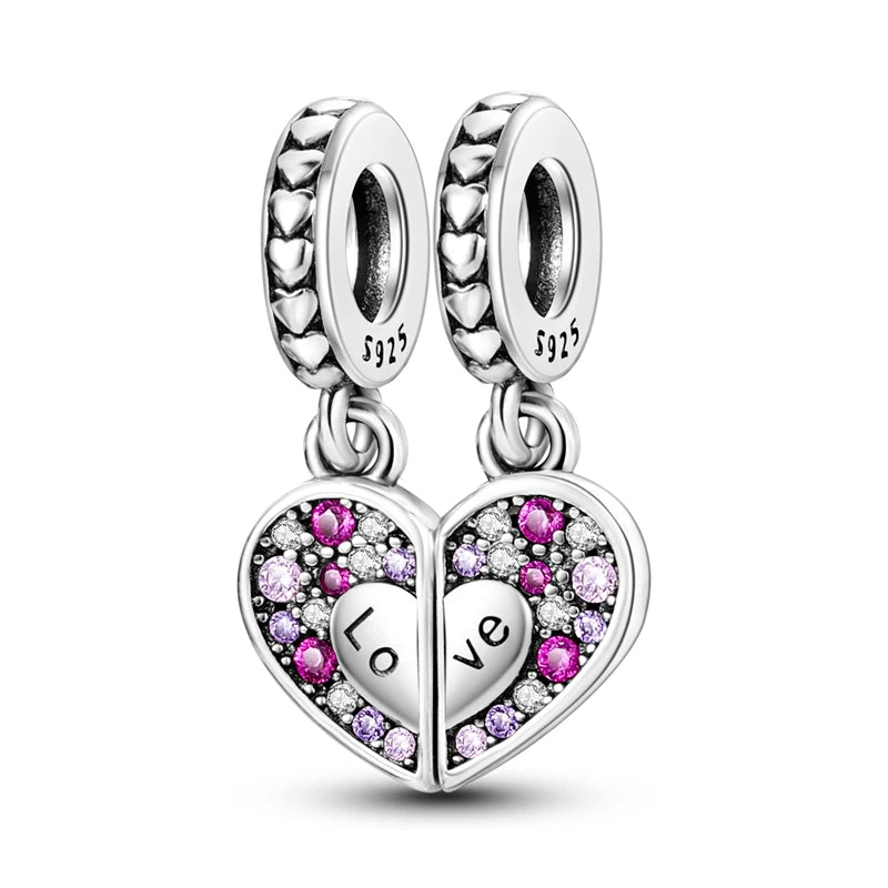 A silver heart charm bead featuring pink zircon stones and a 'love' engraving.