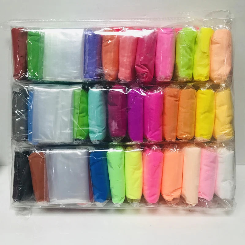 A set of colorful air-dry modeling clay tubes and tools for creative kids