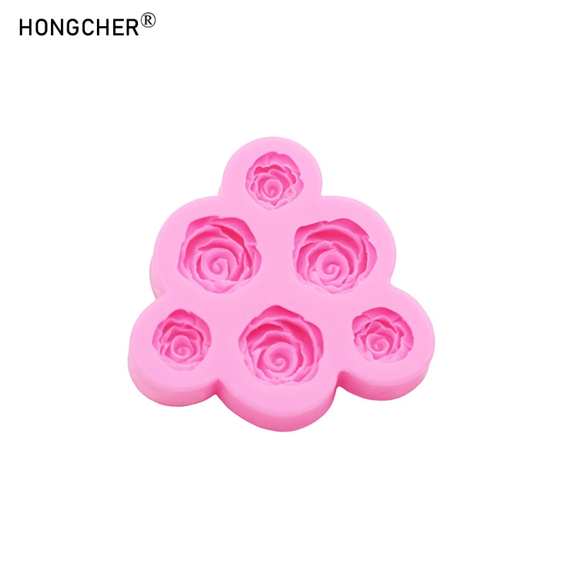 Pink silicone mold with multiple rose and peony shaped cavities for resin, jewelry, or baking.