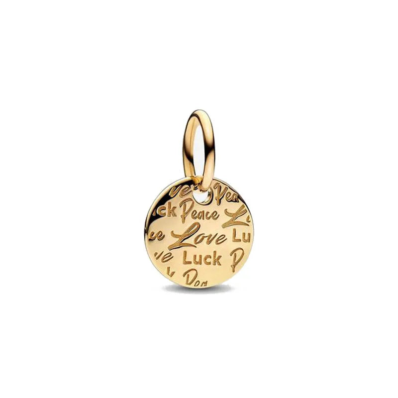 Gold-toned charm bracelet featuring pendants of an elephant, key, butterfly, and heart.