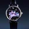 A black watch with a silver bezel featuring a cosmic design of a winged unicorn against a dark background.