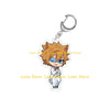 Chibi acrylic keychain of a spiky orange-haired character with blue eyes wearing a white shirt and tie.