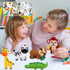 A young girl and woman look at a felt sewing kit featuring various woodland animals like a giraffe, zebra, bear, and dinosaur