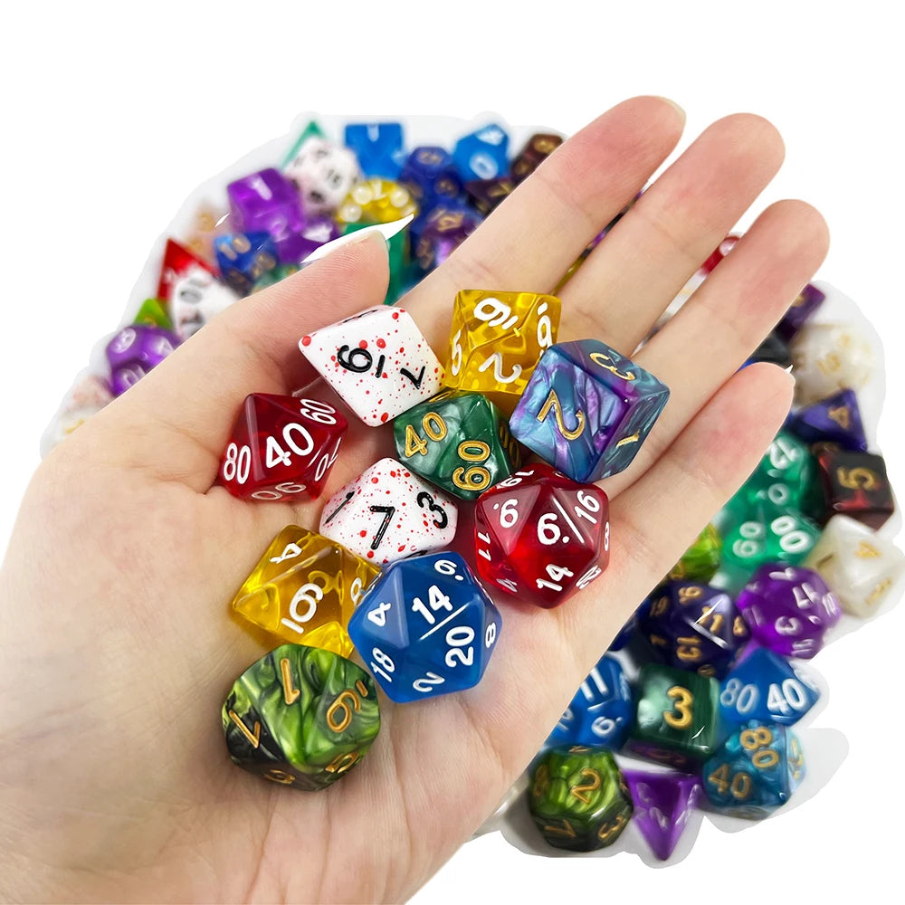 A hand holds a collection of colorful polyhedral dice used for tabletop role-playing games