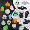 A collection of various Halloween squishy toys including pumpkins, cats, ghosts, and other themed soft stress relief toys.