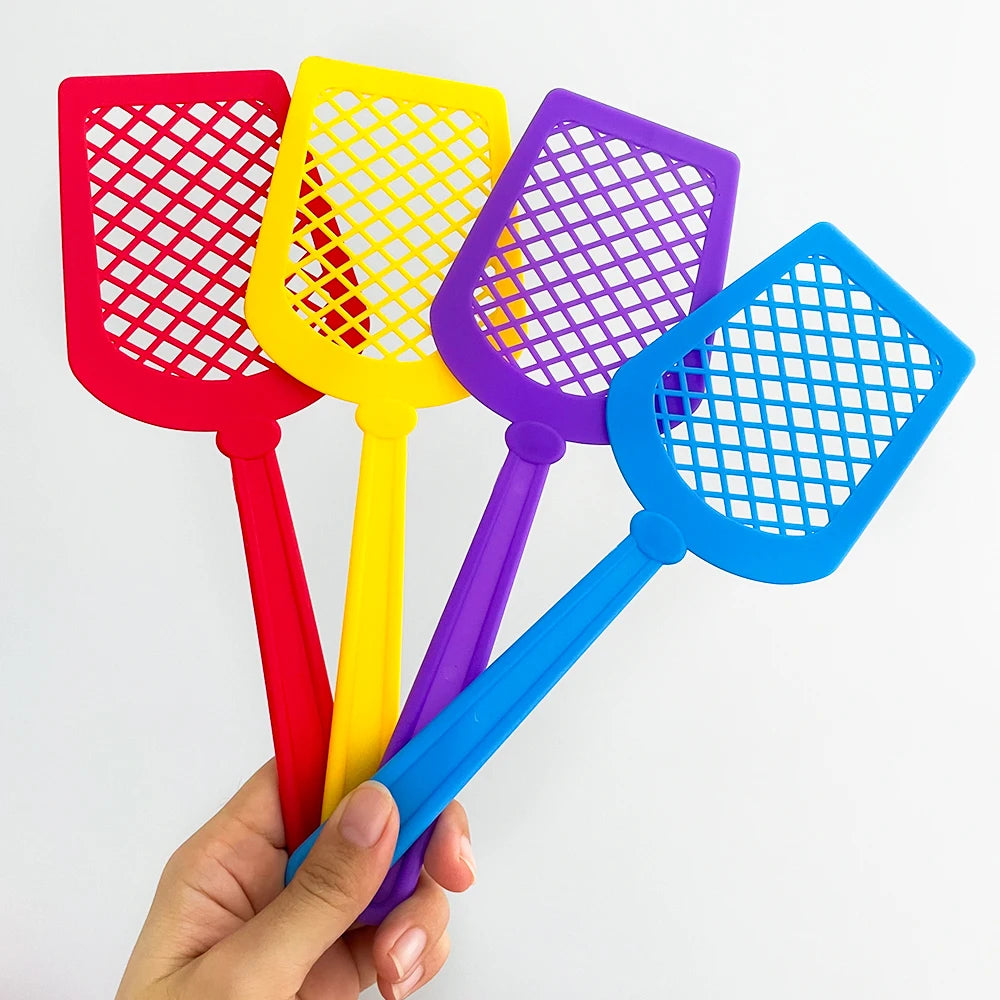 A hand holds a set of four colorful fly swatters for a kids educational learning toy game.