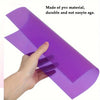 A hand is holding a purple, durable PVC sheet used for DIY crafts and modeling.