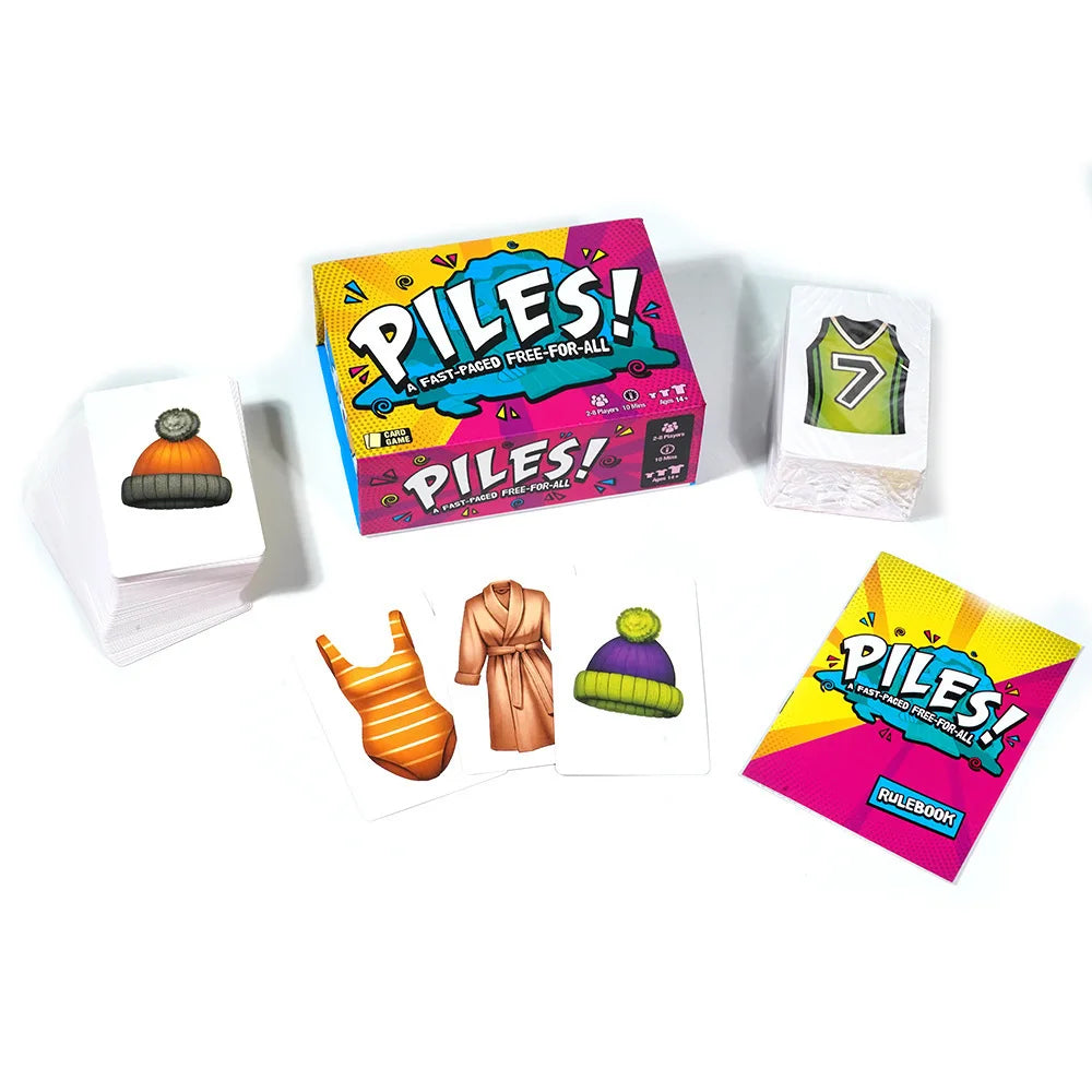 A collection of piles of folding cards and a box labeled Piles! for a party game.