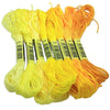 A set of multicolor embroidery floss skeins in yellow and orange colors.