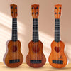 Three wooden acoustic guitars of varying sizes displayed vertically against a light background.
