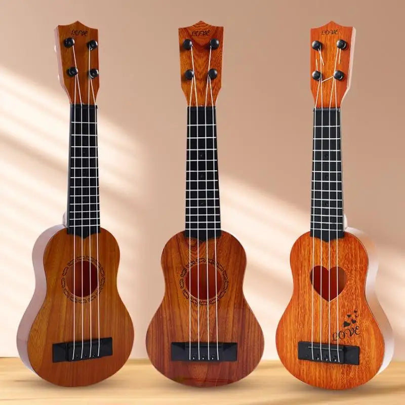 Three wooden acoustic guitars of varying sizes displayed vertically against a light background.