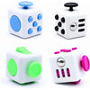 White fidget cube with blue and black buttons and a rotating joystick.