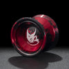 A close-up view of a red and black professional aluminum alloy yo-yo with a stylized graphic design.