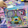 A packaged collectible figure of a princess doll with a golden carriage and various accessories.