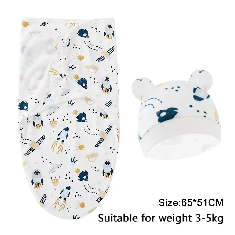 White cotton newborn swaddle blanket and hat set with blue and gold patterns for babies 3-5kg
