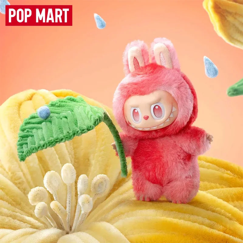 A red Labubu vinyl plush pendant blind box featuring a rabbit face, displayed against a yellow background.