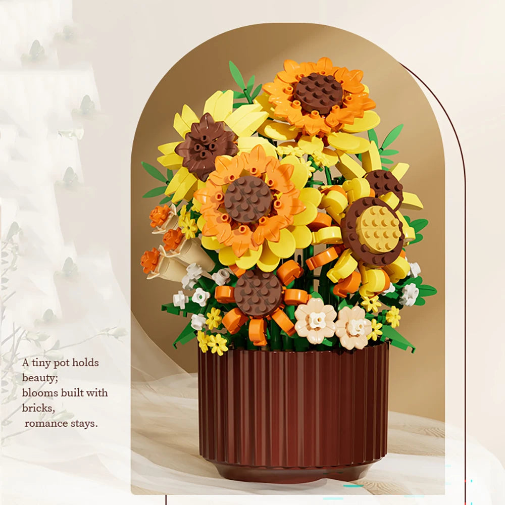 A bouquet of DIY rose and sunflower building blocks in orange, yellow, and brown arranged in a dark pot.