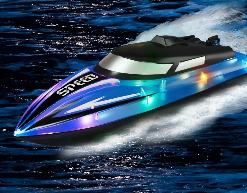 A sleek, blue high-speed RC boat with bright LED lights cutting through dark water.