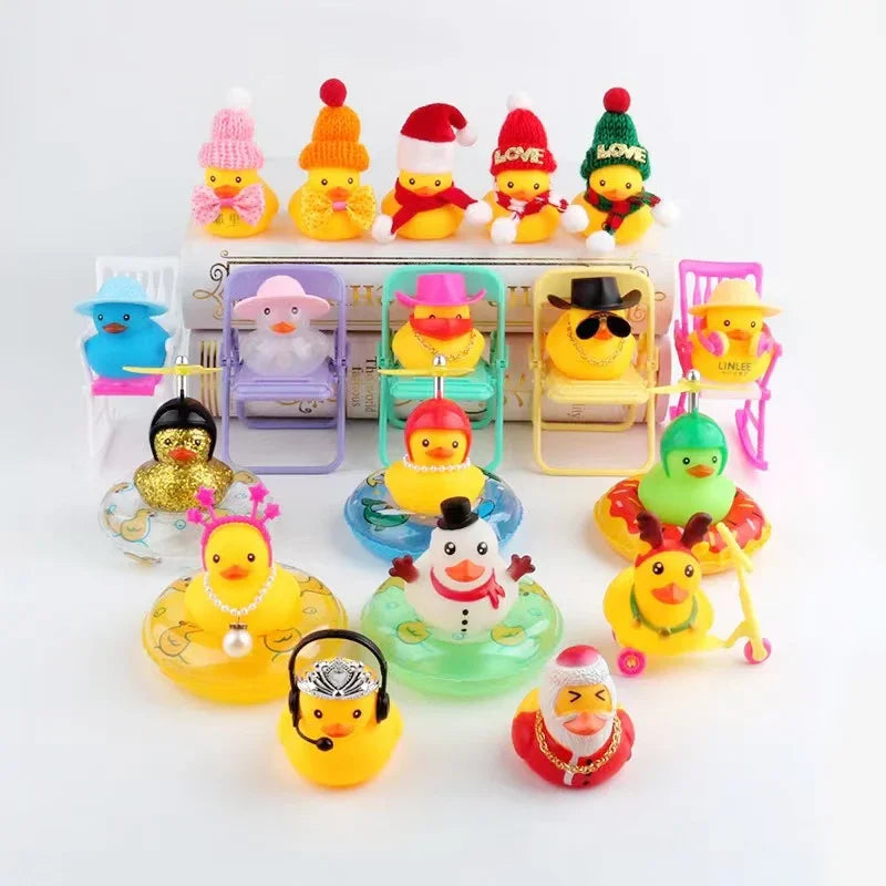 A collection of mini rubber duck accessories including hats, sunglasses, and other items in various colors.