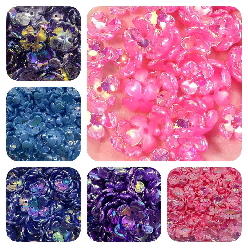 A collection of iridescent acrylic beads in various shades of pink and purple flowers for jewelry making