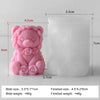 A pink silicone mold shaped like a bear with roses, used for making candles or DIY crafts.