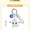 Silver keychain featuring a white Toothless Dragon figure with movable wings and glowing eyes