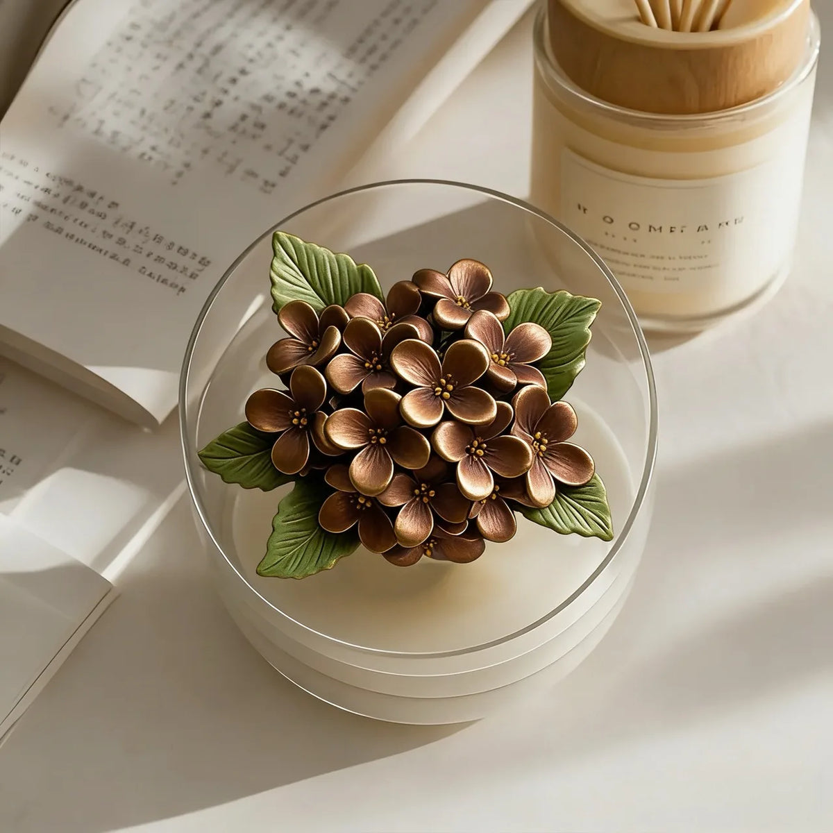 A close-up of a cluster of bronze rose-shaped silicone molds resting on a clear glass, with natural light and a white backgro