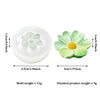A light green silicone mold shaped like a sunflower for candle making or soap crafting